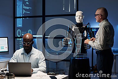 Engineers programming robot in the lab Stock Photo