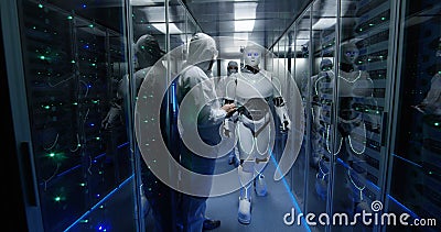 Engineers testing on robot controls inside the laboratory Stock Photo
