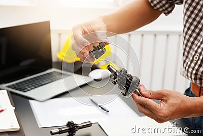 Engineers try to assemble machine parts together. In order to search the machine to help save human labor Stock Photo