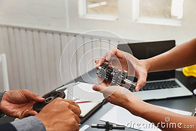 Engineers try to assemble machine parts together. In order to search the machine to help save human labor Stock Photo