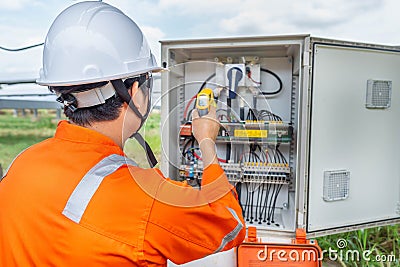 Engineers used a Thermo gun for checking the temperature of the equipment to confirming systems working normally. Concepts Stock Photo