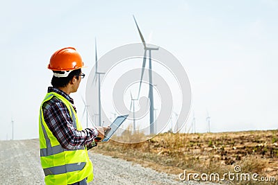 Engineers and wind turbines. Stock Photo