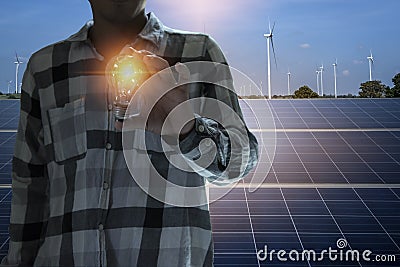 Engineers are working on inspecting solar power generation equipment. Stock Photo