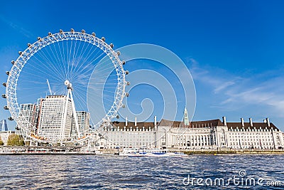 England London - April 20, 2019: London Eye near County Hall in summer view from Thame river boat cruise. Editorial Stock Photo