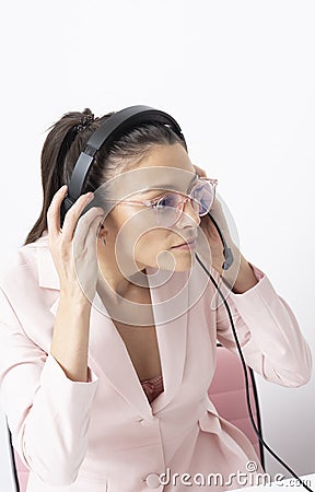 Woman holding headset and ready to speak over the airwaves. Telephonist. Stock Photo