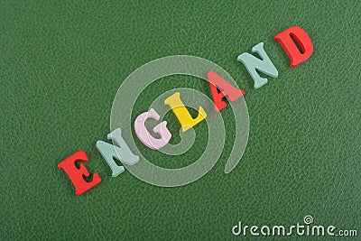 ENGLAND word on green background composed from colorful abc alphabet block wooden letters, copy space for ad text. Learning Stock Photo
