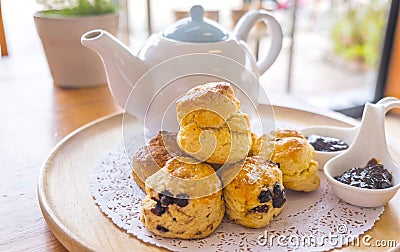 English breakfast and tea break. scones on wooden table with a cup of tea. Stock Photo