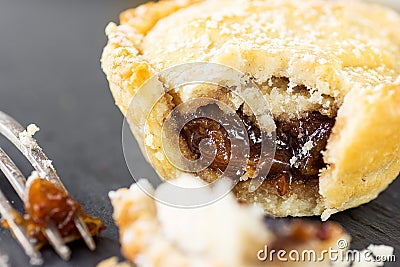 English Christmas Pastry Dessert Home Baked Mince Pie with Apple Raisins Nuts Filling. Nibbled with Visible Filling Texture Stock Photo