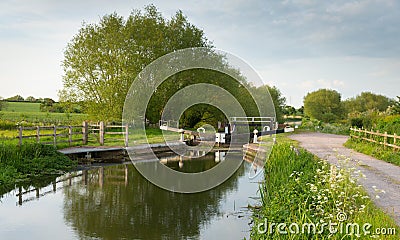 English country scene with canal and lock gates Stock Photo