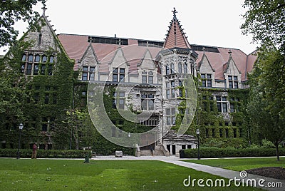 Building in English gothic style and trees Stock Photo