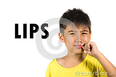 English language learning card with portrait of 8 years old child with fingers on his lips isolated on white background as part of Stock Photo