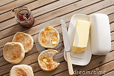 English Muffins, Butter and Jam on Wooden Table Stock Photo