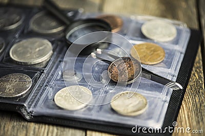 English old coin, magnifier and tweezers, numismatics Stock Photo