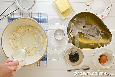 English Scones ingredients above, adding milk Stock Photo