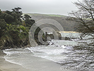 English shoreline with cliffs, castle ruins and sea waves Stock Photo