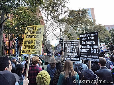 English and Spanish Language Signs, Anti-Trump Protest, Washington Square Park, NYC, NY, USA Editorial Stock Photo