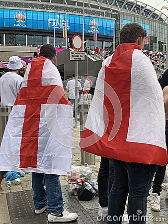 English supporters with England flags at Wembley stadium ahead of the match against Italy Editorial Stock Photo