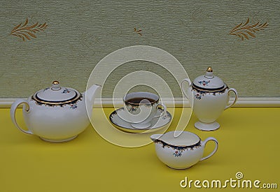 English teacup with saucer, teapot, sugar bowl and cream jug, fine bone china porcelain Stock Photo