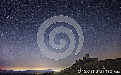 Enisala fortress by night, starry sky, visible Milky Way galaxy, clear sky, long exposure Stock Photo