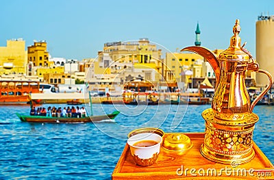 Enjoy Arabic coffee on the bank of Dubai Creek, UAE Stock Photo