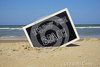 Enjoy the beach written Stock Photo