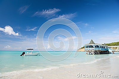 Enjoy benefits being beside sea. Sea turquoise water bungalow and ship near beach. Vacation sea sand beach tropical Stock Photo