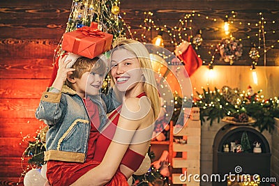 Enjoy every moment with her son. Spend holidays together. Family love. Mother and baby son celebrate christmas at home Stock Photo