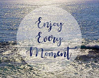 Enjoy every moment.Inspirational quote on beautiful ocean view background. Stock Photo