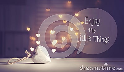 Enjoy The Little Things message with a white heart Stock Photo