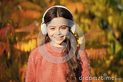 Enjoy music fall day. Autumn walks with nice songs. Educational and downloadable audio books for children. Kid girl Stock Photo