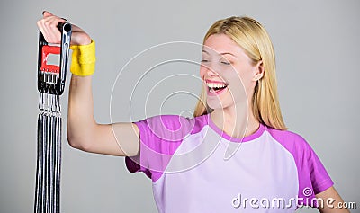Enjoy result. Woman stretch expander sport equipment with effort. How use equipment proper way. Exercising with expander Stock Photo