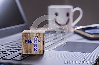 Enjoy work text on laptop Stock Photo