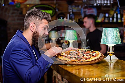 Enjoy your meal. Cheat meal concept. Hipster hungry eat italian pizza. Pizza favorite restaurant food. Fresh hot pizza Stock Photo