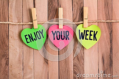 Enjoy your week heart shaped note Stock Photo