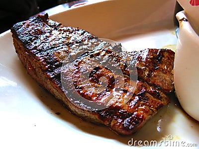 Enjoying a beef steak for dinner Stock Photo