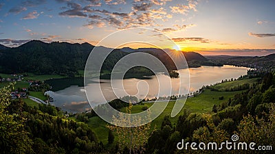 Enjoying the last sunlight over Lake Schliersee in bavarian mountain range. Stock Photo