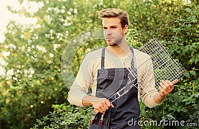 Enjoying lunch outdoors. picnic cooking utensils. Outdoor party weekend. man barbecue grill. Tools for roasting meat Stock Photo