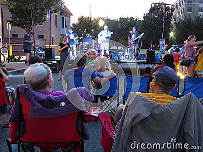 Enjoying the music at the Outdoor Festival in August Editorial Stock Photo