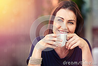 Enjoying a relaxed cuppa. a woman drinking a cup of coffee. Stock Photo