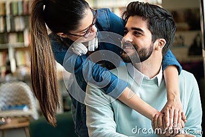 Enjoying student life. Smiling young happy students couple studying and having fun together Stock Photo
