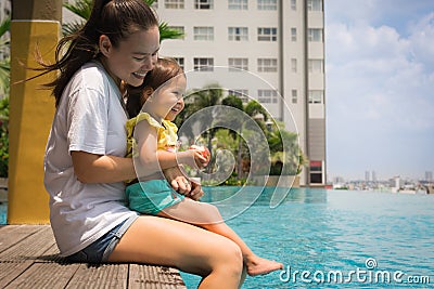 Fun family pool time with mother and child. Vacation time. Stock Photo