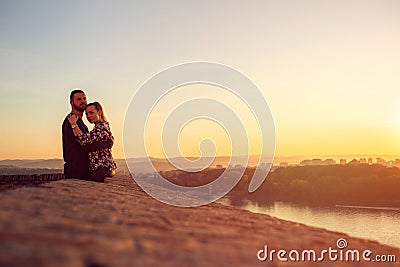 Enjoying time together. man and woman hugging at sunset Stock Photo