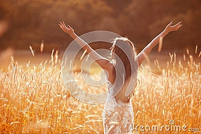 Enjoyment. Free woman arms outstretched. Happy bride with long w Stock Photo