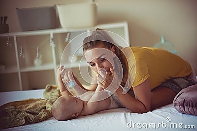 She enjoys every minute spent with her baby Stock Photo