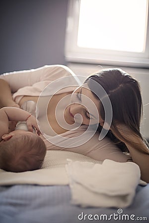 She enjoys at every moment devoted to her baby Stock Photo