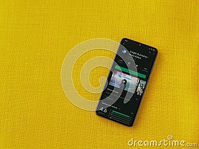 Enlight Quickshot app play store page on smartphone on a yellow fabric background Editorial Stock Photo