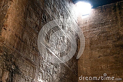 Enlightened hieroglyphs Inside the sanctuary at the centre of the egyptian Temple of Horus at Edfu, in Egypt Stock Photo