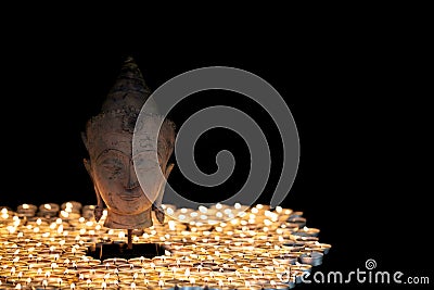 Enlightenment. Spiritual image of serene buddha head illuminated Stock Photo