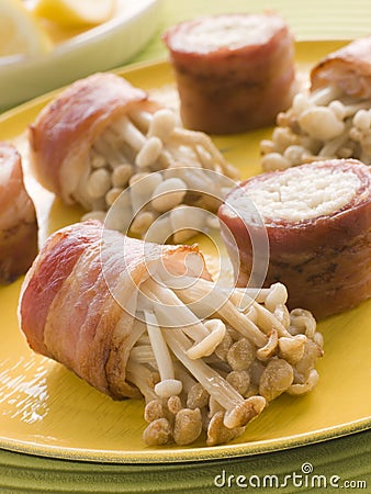 Enoki Mushrooms wrapped in Smoked Bacon Stock Photo