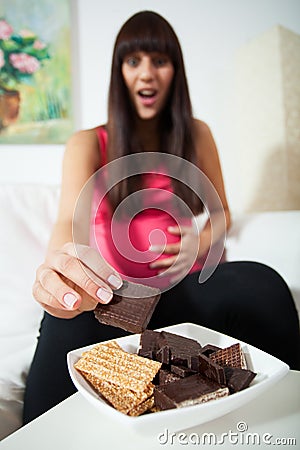 Enormous appetite during pregnancy Stock Photo